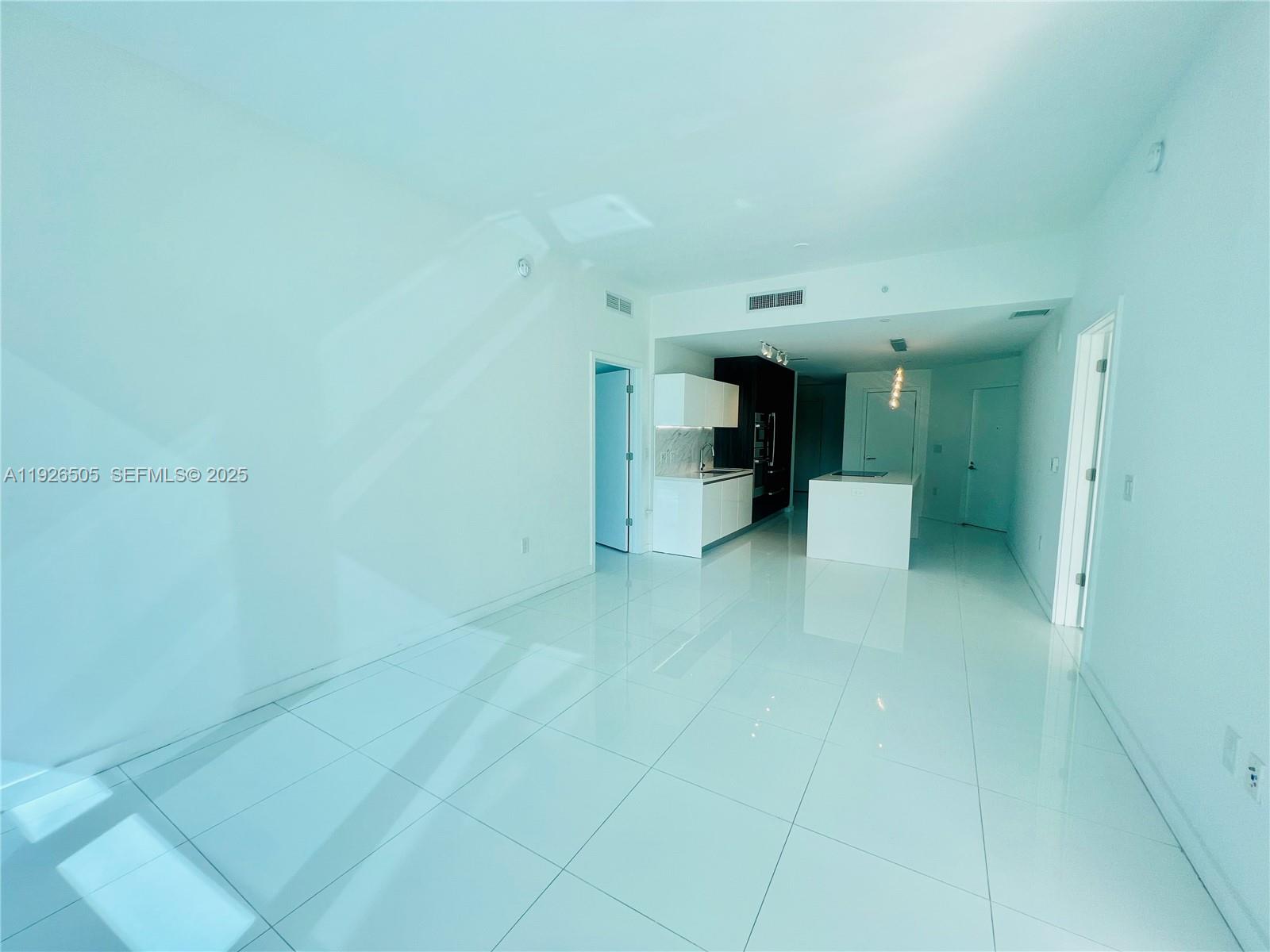 851 Northeast 1st Avenue, Unit 2808 Miami, FL 33132 - Photo 17 of 86 a view of a hallway with a bathroom