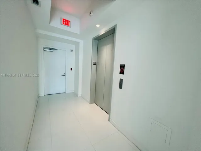 a large room with furniture and a large window