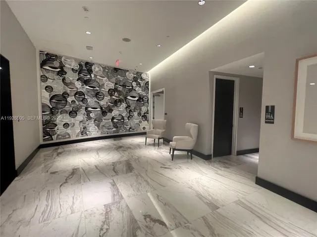 a bathroom with a bathtub and a window