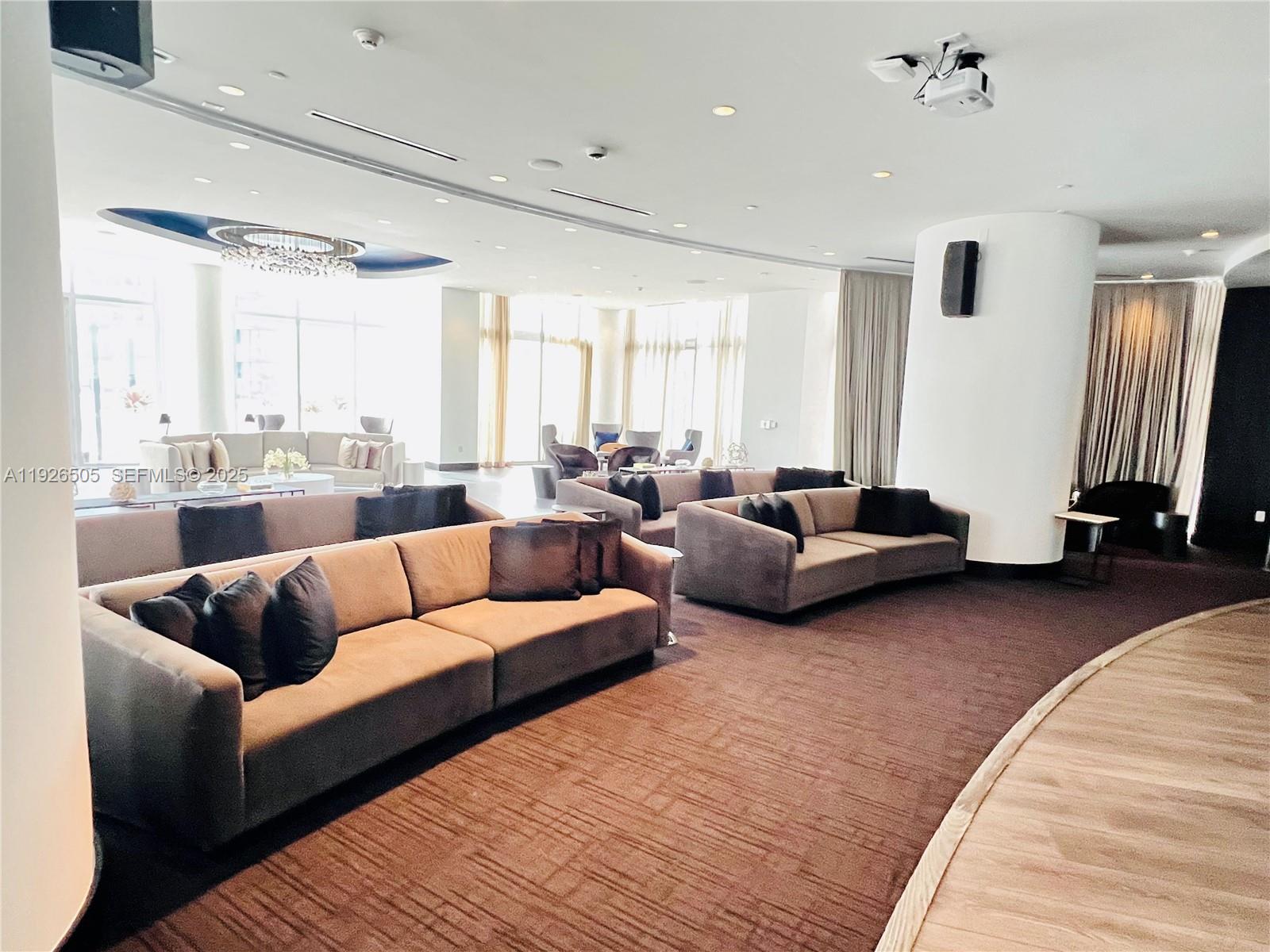 851 Northeast 1st Avenue, Unit 2808 Miami, FL 33132 - Photo 35 of 86 a living room with furniture and a large window