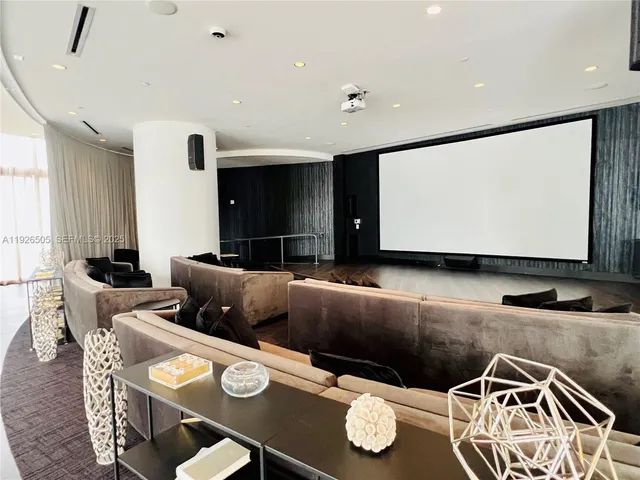 a lobby with furniture and stairs