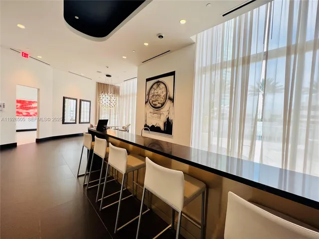 a view of a living room and kitchen