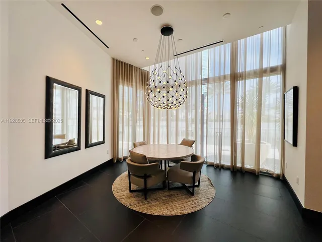 a room with gym equipment and a large mirror