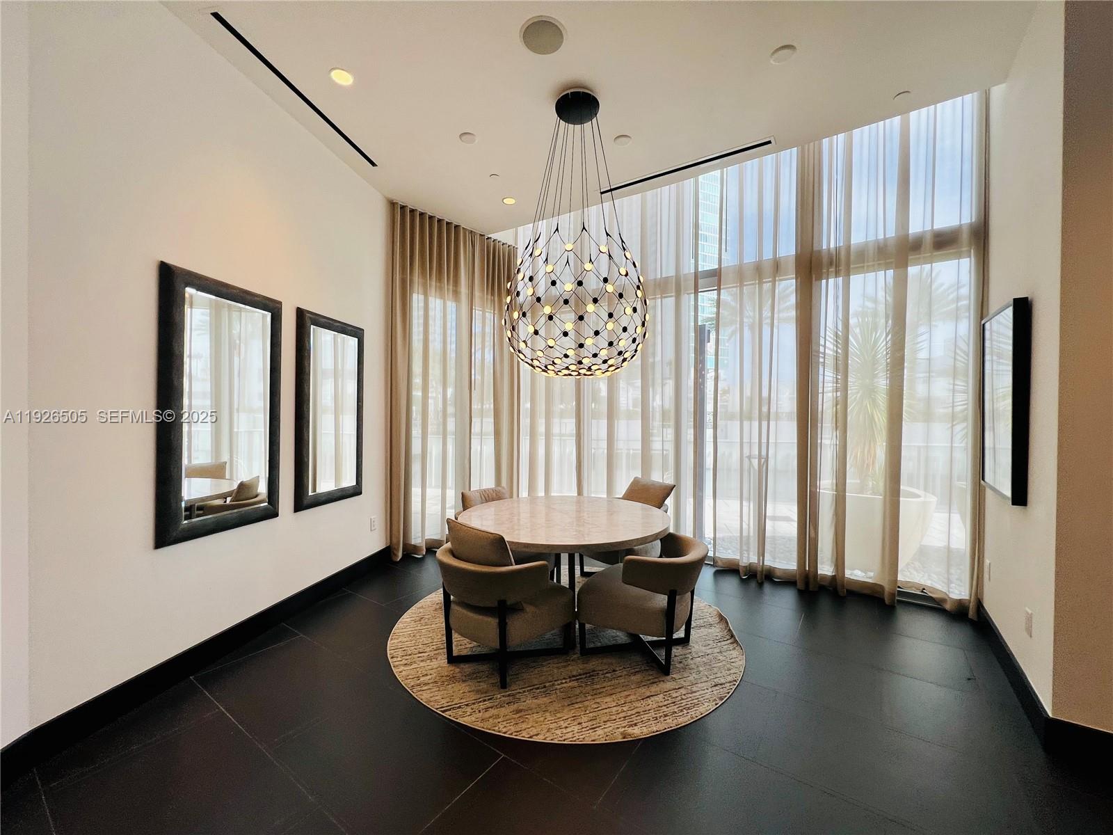 851 Northeast 1st Avenue, Unit 2808 Miami, FL 33132 - Photo 41 of 86 a living room with furniture and a large window