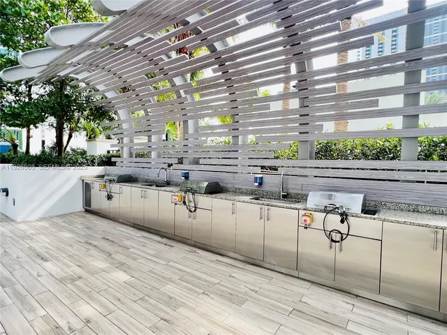 a view of a dining room with furniture and floor to ceiling window