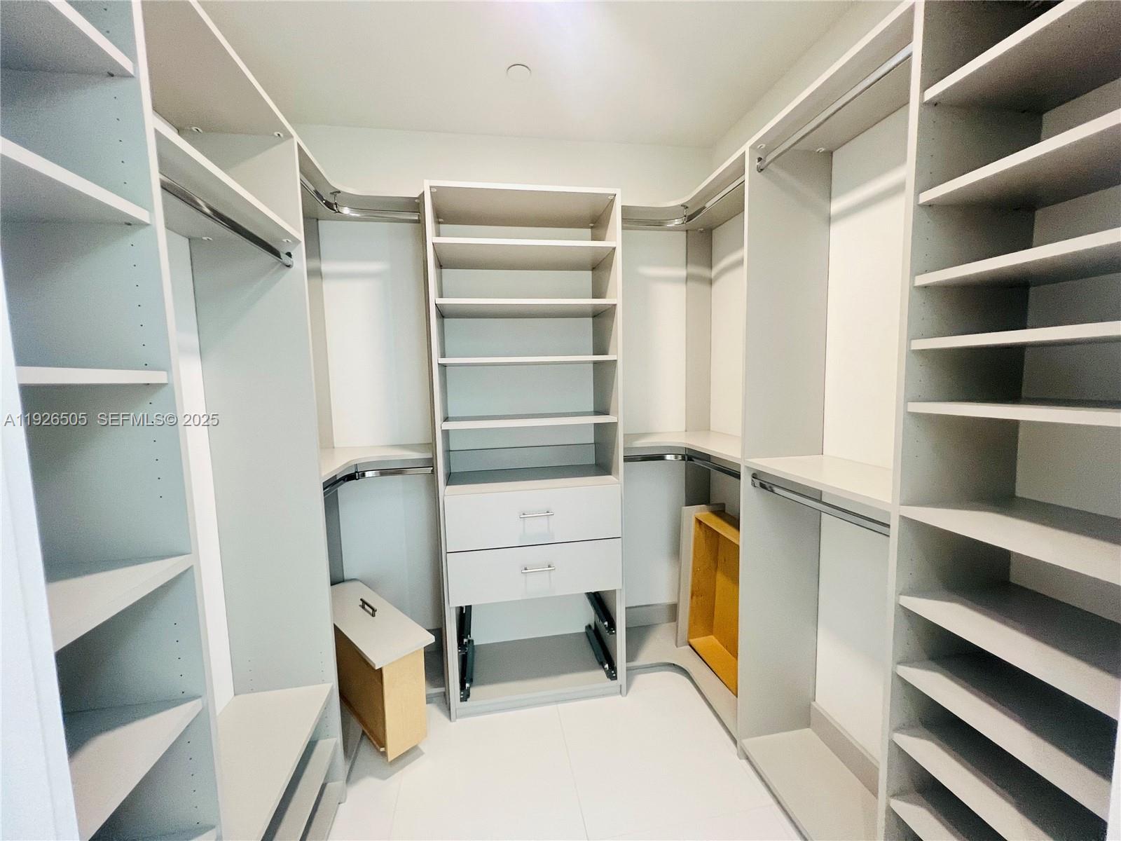 851 Northeast 1st Avenue, Unit 2808 Miami, FL 33132 - Photo 6 of 86 a view of walk in closet with empty racks