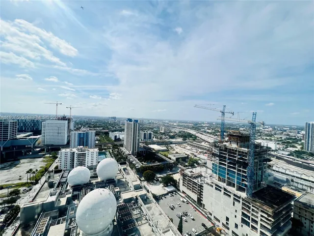 a bathroom with a sink double vanity mirror and a bathtub