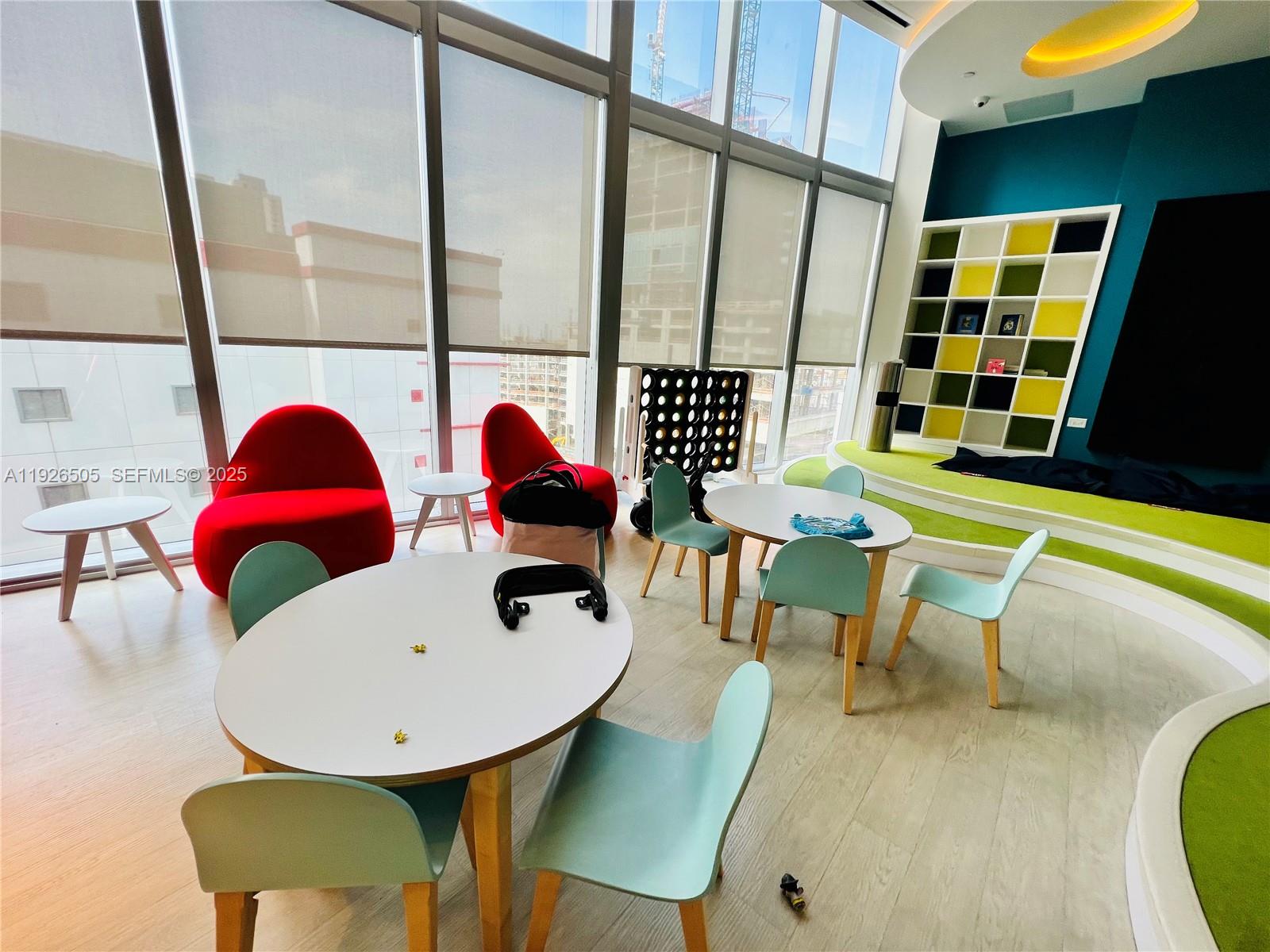 851 Northeast 1st Avenue, Unit 2808 Miami, FL 33132 - Photo 71 of 86 a view of a dining room with furniture and floor to ceiling window