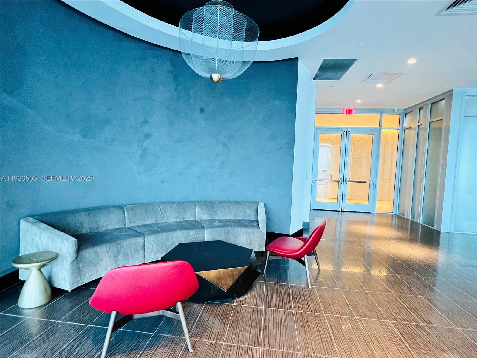 851 Northeast 1st Avenue, Unit 2808 Miami, FL 33132 - Photo 86 of 86 a living room with furniture and a table