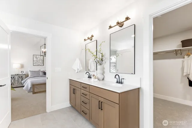 a bathroom with a double vanity sink a mirror and a shower