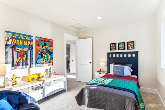 a bedroom with a bed and a couch