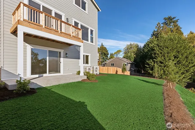 a view of a house with a yard and plants