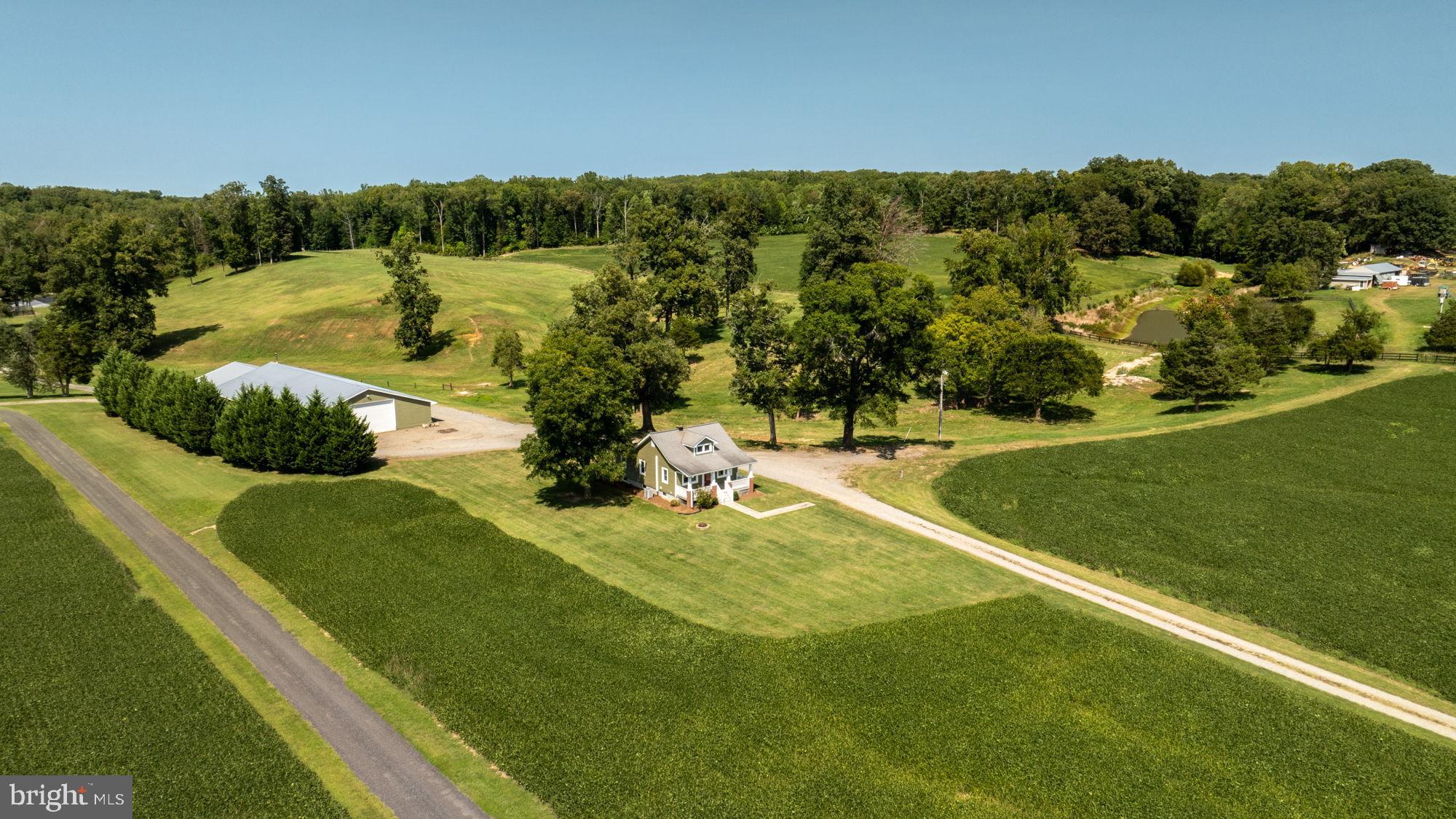 161 Forest Lane Road Fredericksburg, VA 22405 - Photo 1 of 99 Serene countryside retreat with lush fields.
