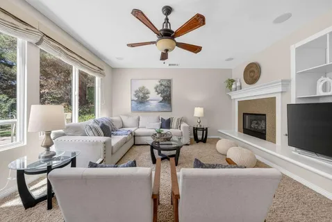 a dining area with stainless steel appliances kitchen island granite countertop a dining table and chairs