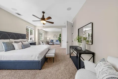 a large kitchen with a sink and cabinets