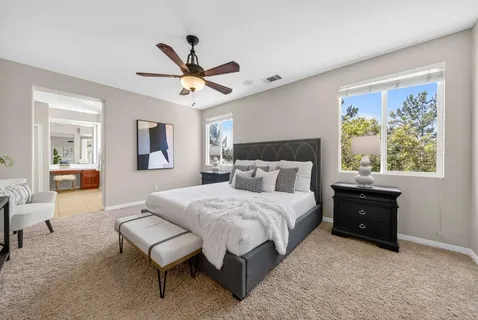 a large bathroom with a tub and sink