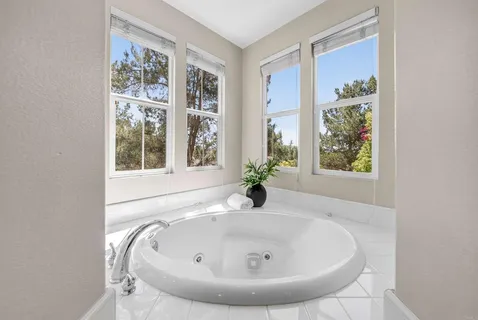 a view of a dining room with furniture and window
