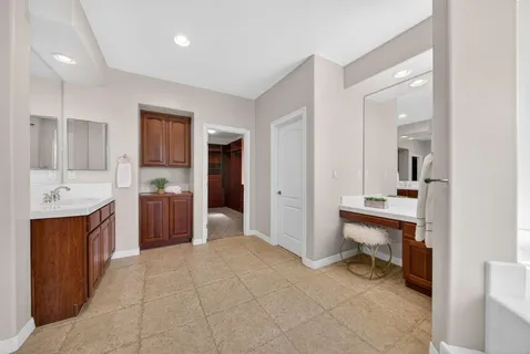 a view of an empty room and closet area