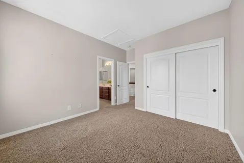 a front view of a house with yard and green space