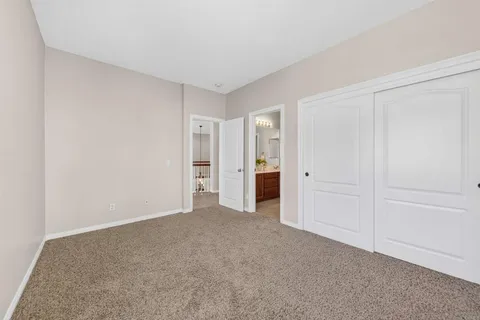 an aerial view of a house with swimming pool and garden