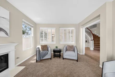 a spacious bedroom with a bed and a couch