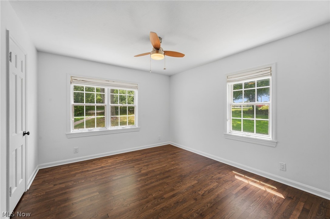 7750 Lewis Road Olmsted Falls, OH 44138 - Photo 25 of 50 Spacious room featuring rich wood-finish flooring and bright white walls