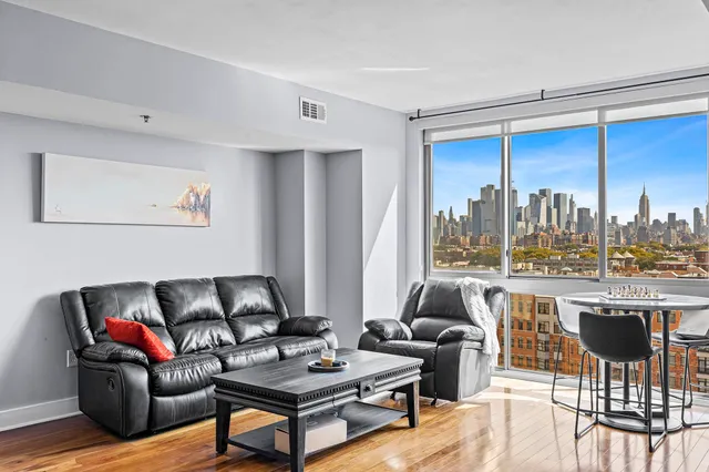 a living room with furniture and a large window