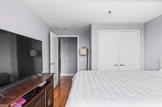 a bedroom with a bed and a dresser