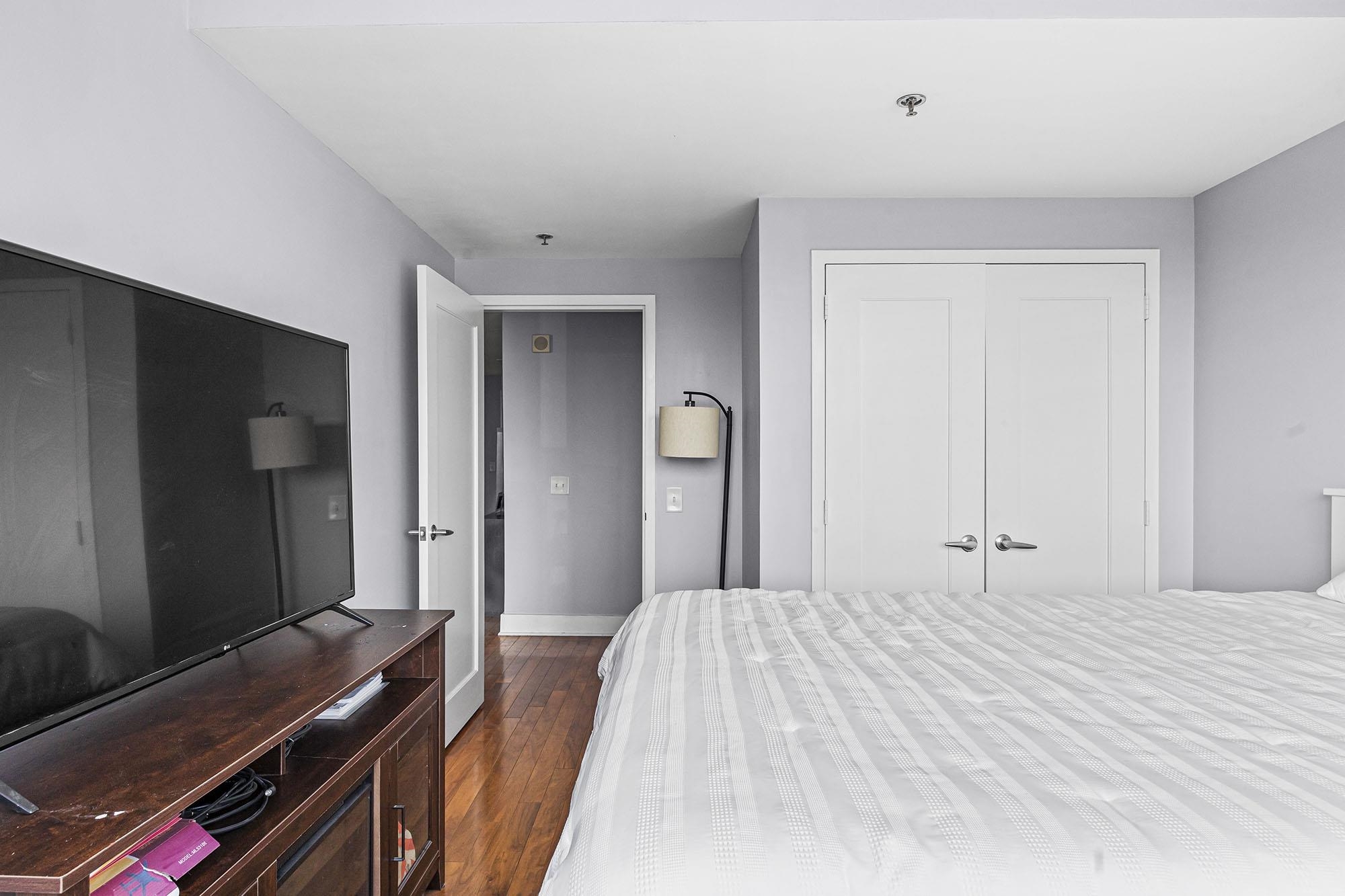 800 Jackson Street, Unit PH7 Hoboken, NJ 07030 - Photo 13 of 22 a bedroom with a bed and a dresser