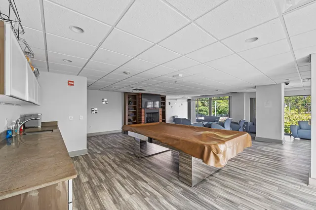 a bed room with a bed and a large window