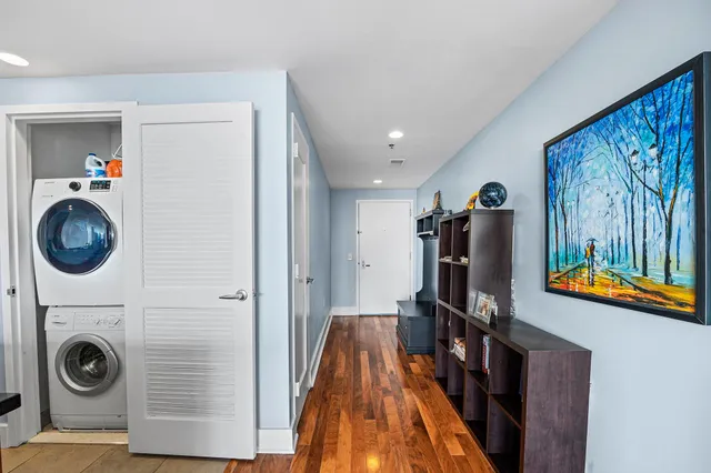 a view of a hallway with washer and dryer