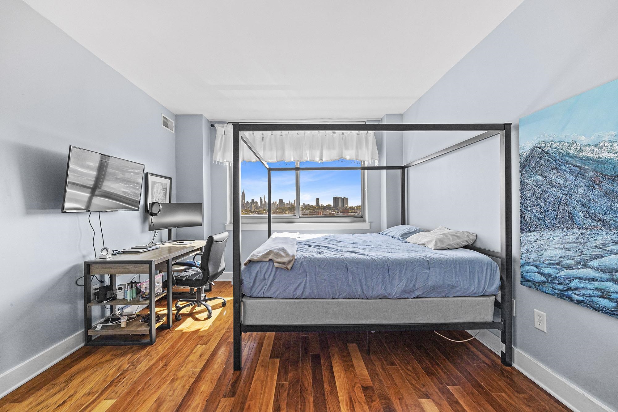 800 Jackson Street, Unit PH7 Hoboken, NJ 07030 - Photo 9 of 22 a bedroom with a bed and wooden floor