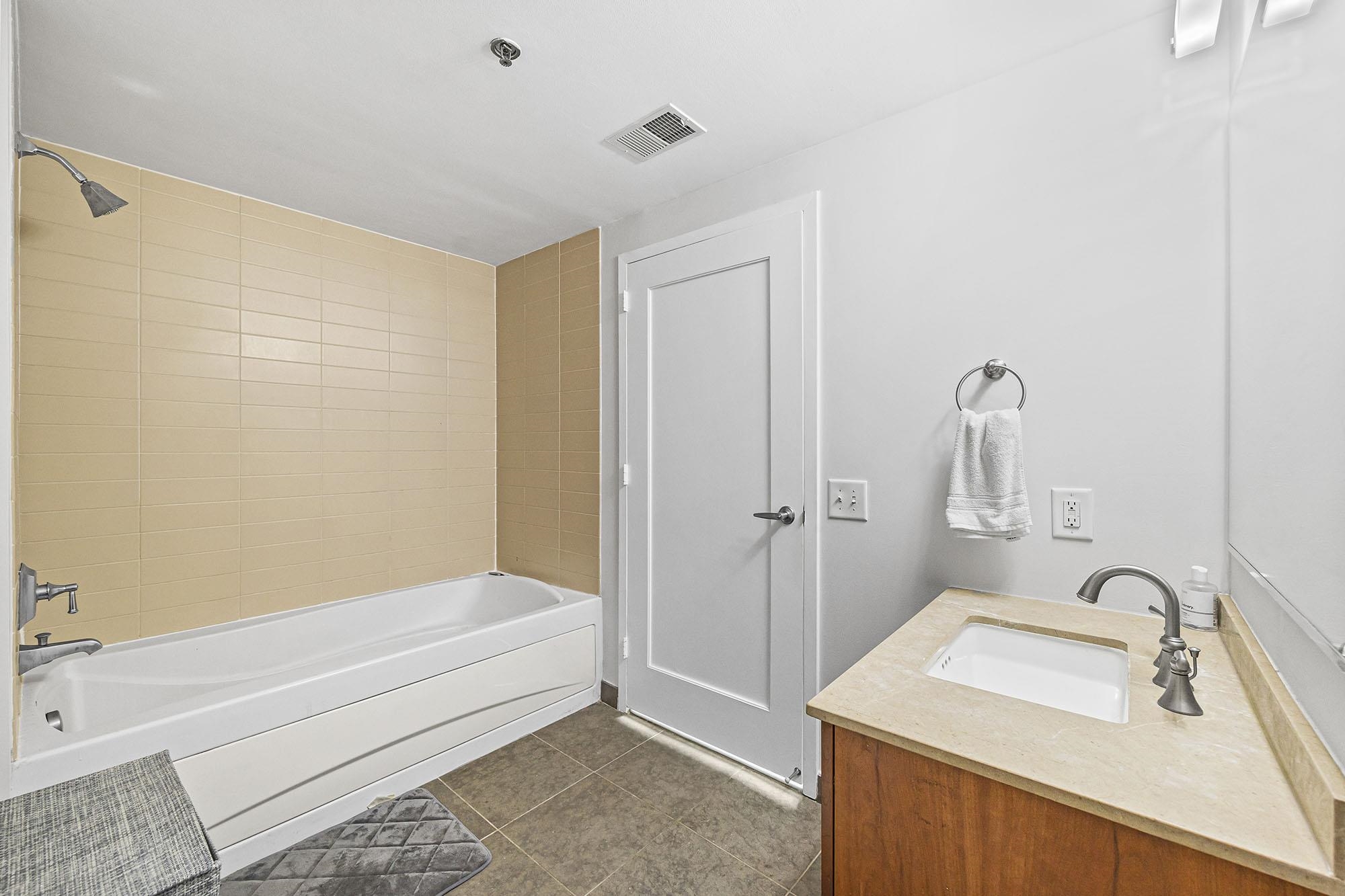800 Jackson Street, Unit PH7 Hoboken, NJ 07030 - Photo 10 of 22 a bathroom with a sink and a bathtub