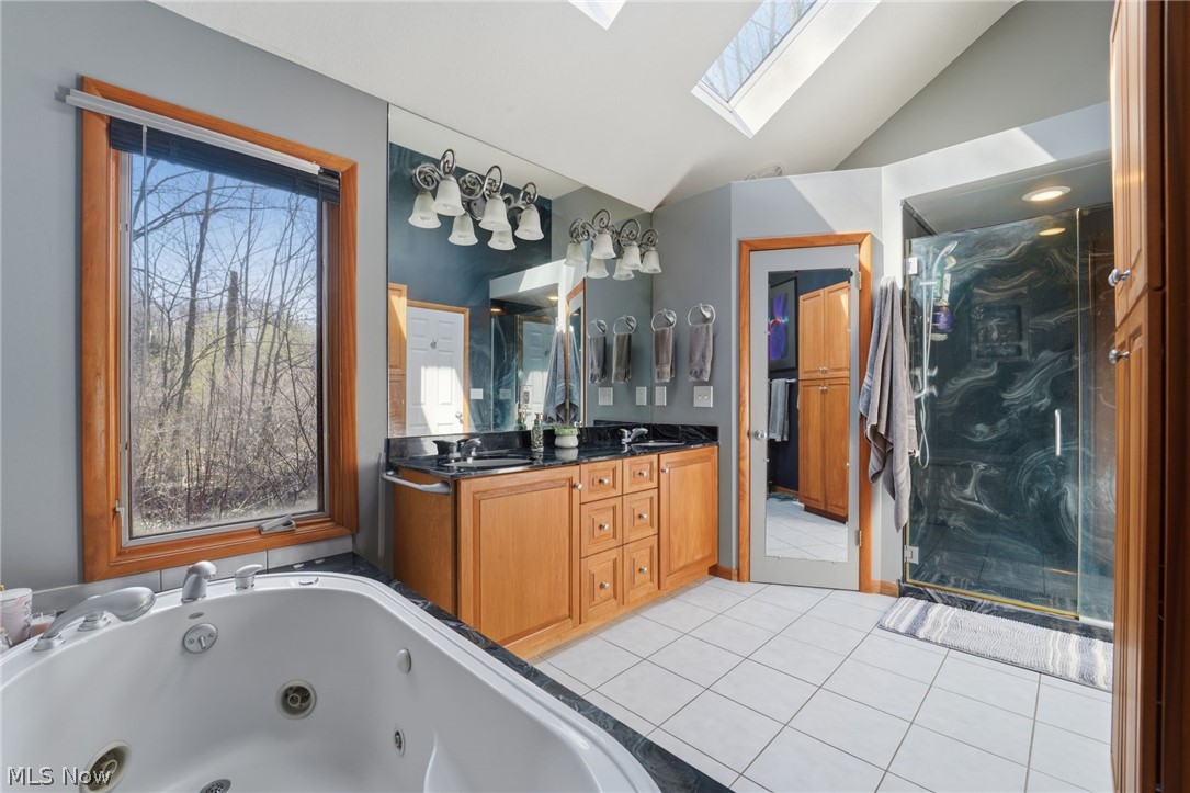 8965 Cedar Road Chesterland, OH 44026 - Photo 24 of 50 Ceramic Flooring, Jetted Tub, Large Walk in Shower, Separate Commode Room, Double Vanity, Two Skylights