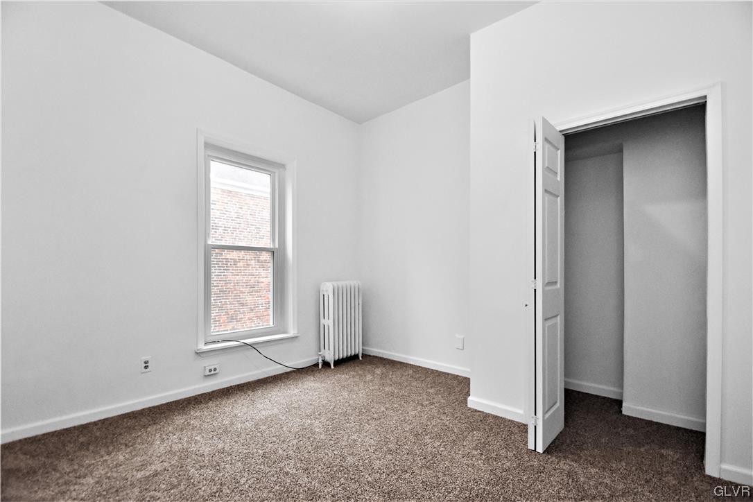 28 South 5th Street Emmaus, PA 18049 - Photo 19 of 23 an empty room with windows and closet