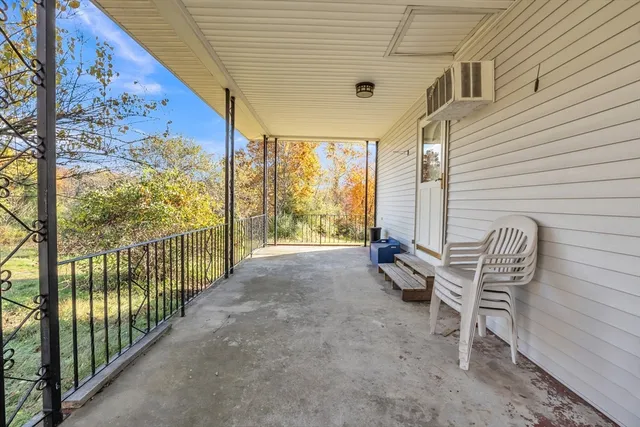 a view of a two chairs in the balcony