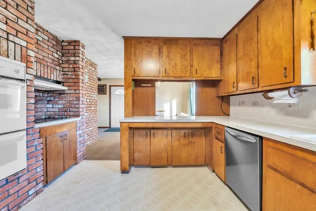 a kitchen with a refrigerator and cabinets