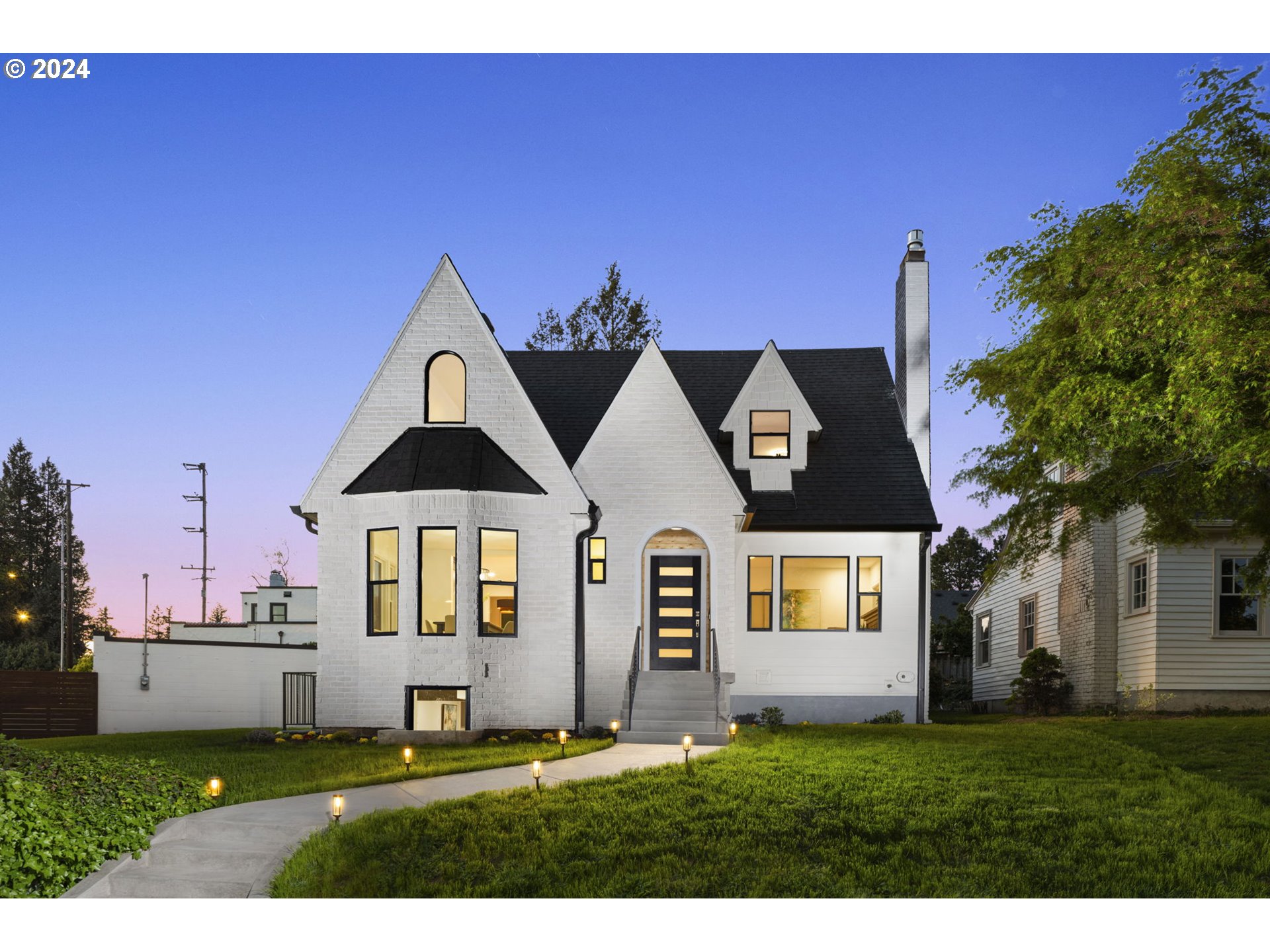 a front view of a house with a yard