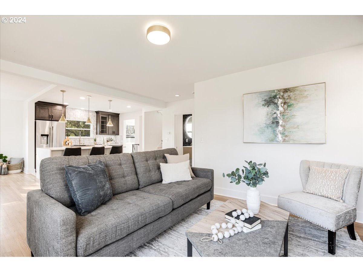 2639 North Sumner Street Portland, OR 97217 - Photo 15 of 46 a living room with furniture and a couch