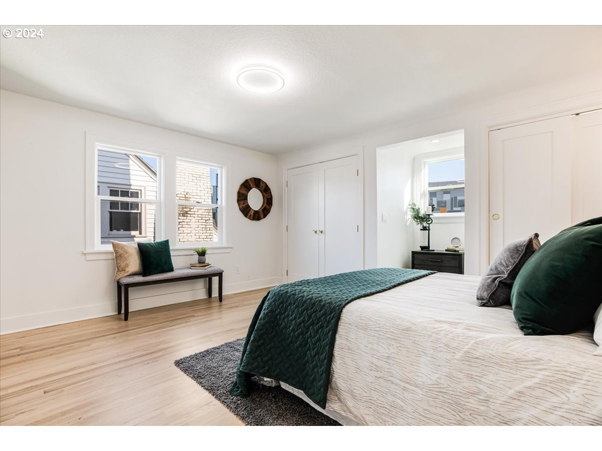 2639 North Sumner Street Portland, OR 97217 - Photo 24 of 46 a bedroom with a bed and windows