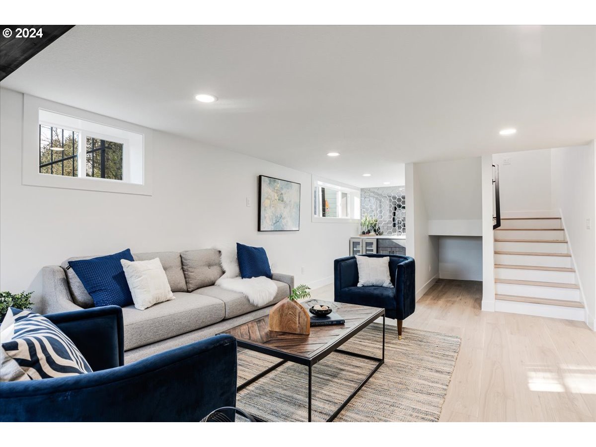 2639 North Sumner Street Portland, OR 97217 - Photo 28 of 46 a living room with furniture and a wooden floor