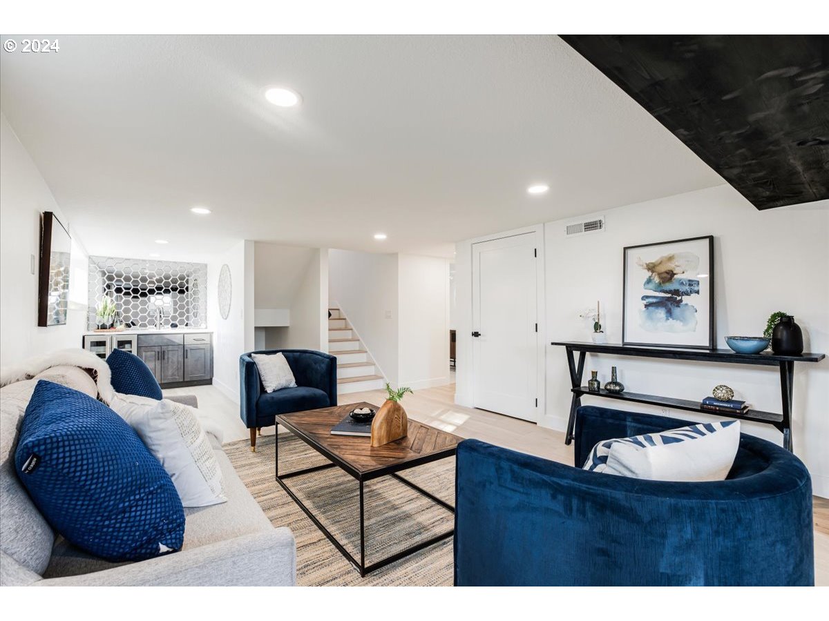 2639 North Sumner Street Portland, OR 97217 - Photo 31 of 46 a living room with furniture and a flat screen tv