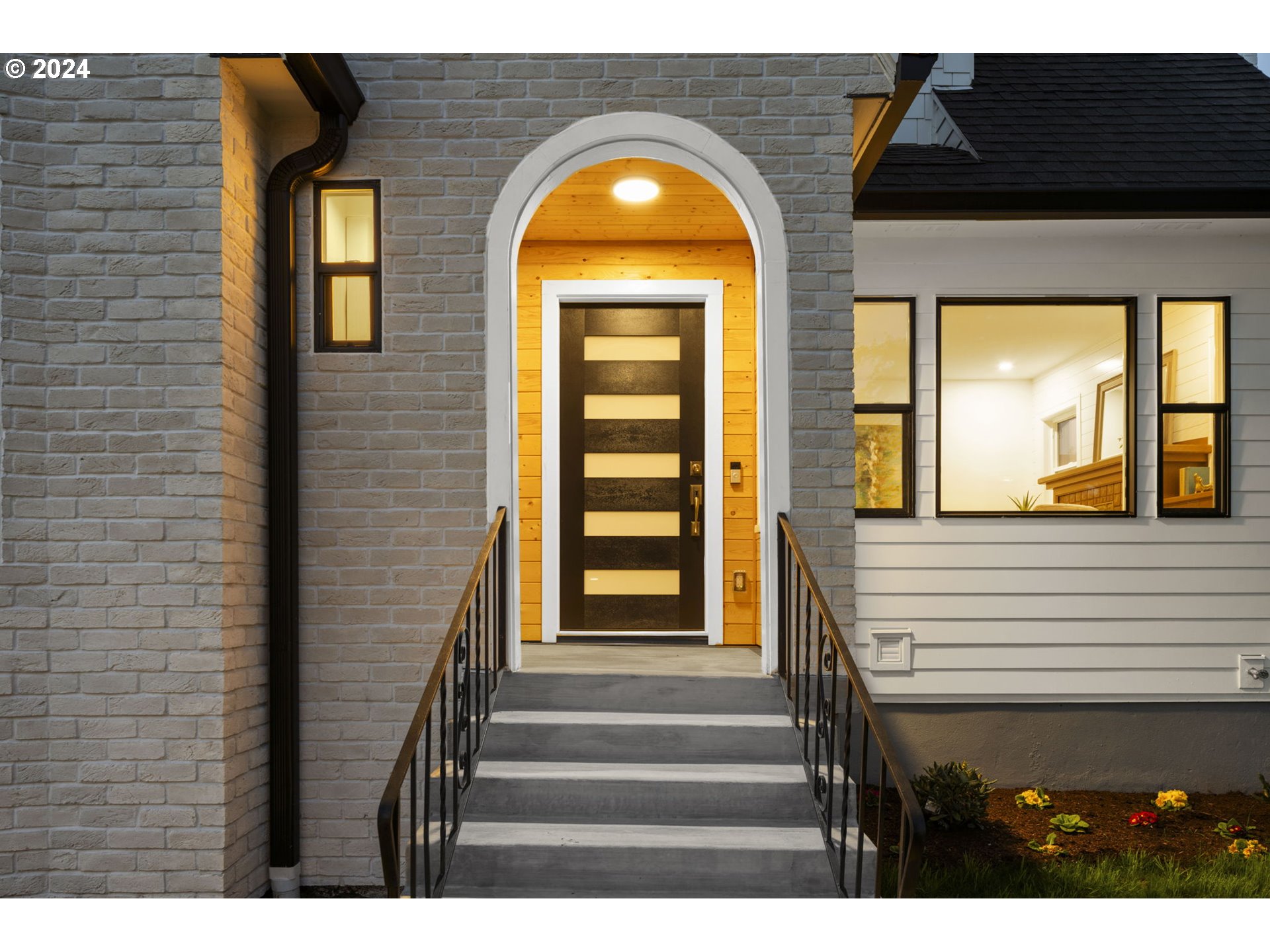 2639 North Sumner Street Portland, OR 97217 - Photo 4 of 46 a view of a brick house with a large window