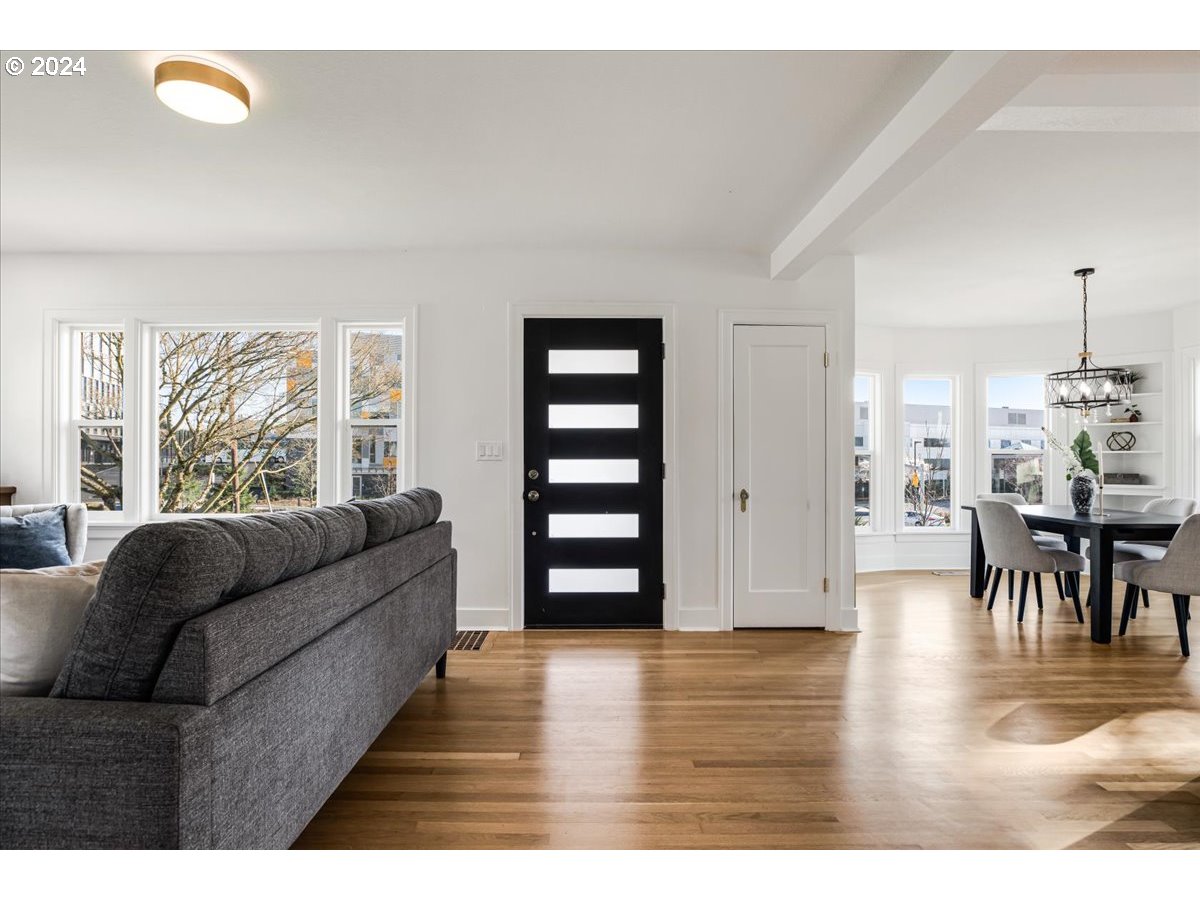 2639 North Sumner Street Portland, OR 97217 - Photo 5 of 46 a living room with furniture and wooden floor