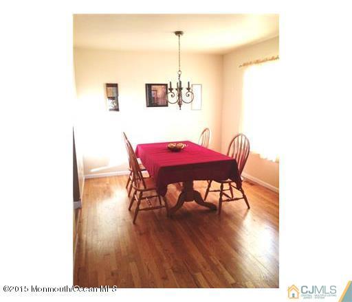 45 Starlight Road Howell, NJ 07731 - Photo 2 of 14 a dining room with furniture and wooden floor