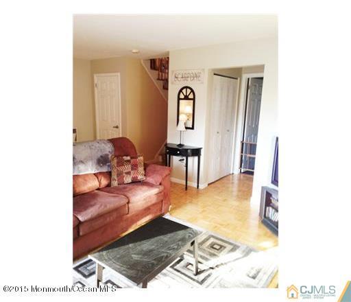 45 Starlight Road Howell, NJ 07731 - Photo 11 of 14 a living room with furniture and a rug