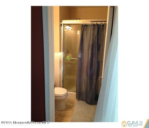 45 Starlight Road Howell, NJ 07731 - Photo 13 of 14 a bathroom with a shower and a toilet