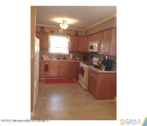 45 Starlight Road Howell, NJ 07731 - Photo 5 of 14 a kitchen with stainless steel appliances granite countertop a stove a sink and a refrigerator