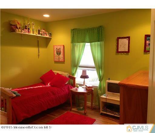 45 Starlight Road Howell, NJ 07731 - Photo 8 of 14 a bedroom with a bed and furniture