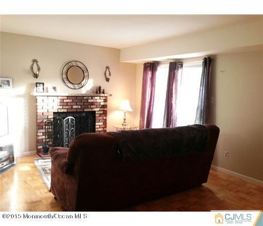 45 Starlight Road Howell, NJ 07731 - Photo 10 of 14 a living room with furniture and a fireplace